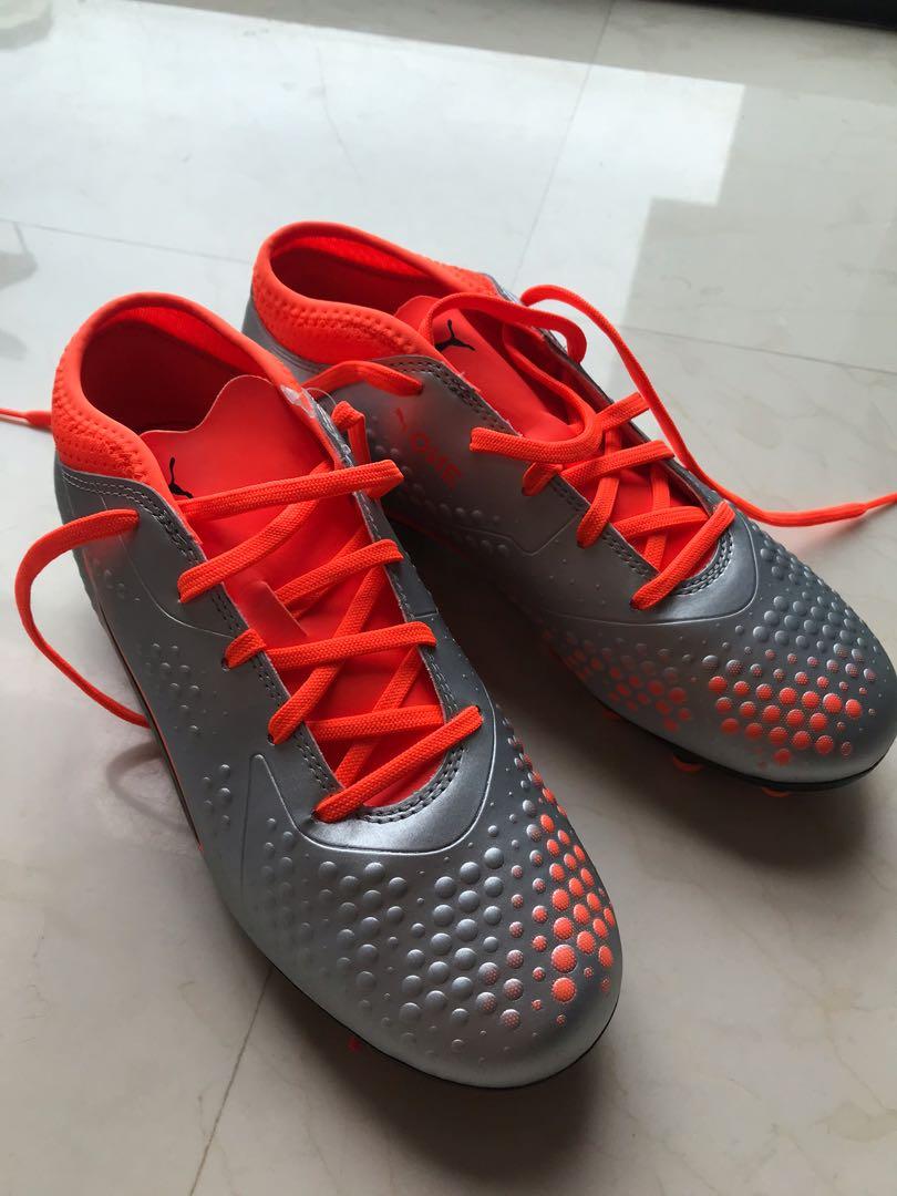 orange kids football boots