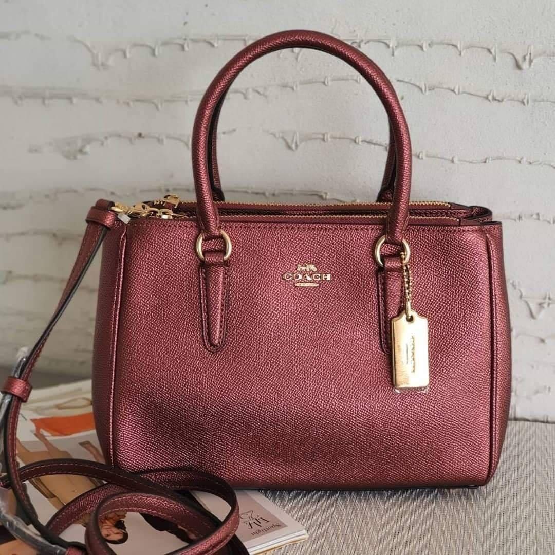 Coach mini surrey metallic wine (Category: Purses & Pouches) located in Bacoor. Submitted by itsmhauiii (Listing ID 1039455557, Image 1). Description: Original with tag, receipt, carecard and paperbag. Moneyback guaranteed if fake! 💯.