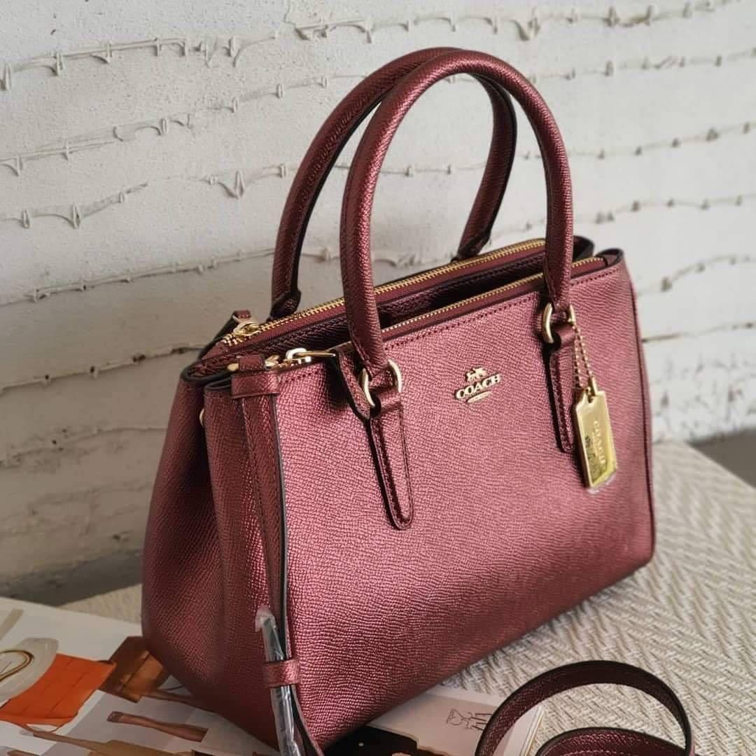 Coach mini surrey metallic wine (Category: Purses & Pouches) located in Bacoor. Submitted by itsmhauiii (Listing ID 1039455557, Image 2). Description: Original with tag, receipt, carecard and paperbag. Moneyback guaranteed if fake! 💯.