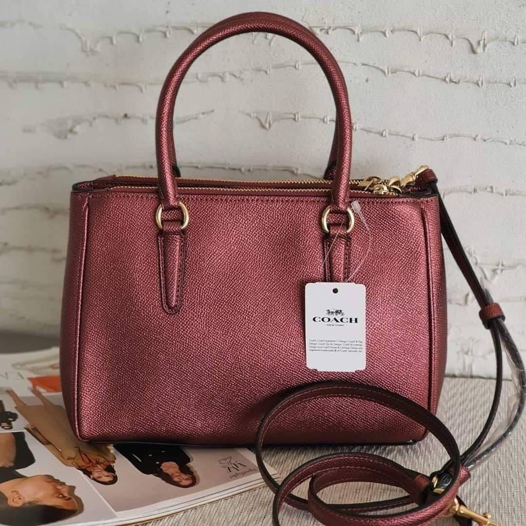 Coach mini surrey metallic wine (Category: Purses & Pouches) located in Bacoor. Submitted by itsmhauiii (Listing ID 1039455557, Image 3). Description: Original with tag, receipt, carecard and paperbag. Moneyback guaranteed if fake! 💯.