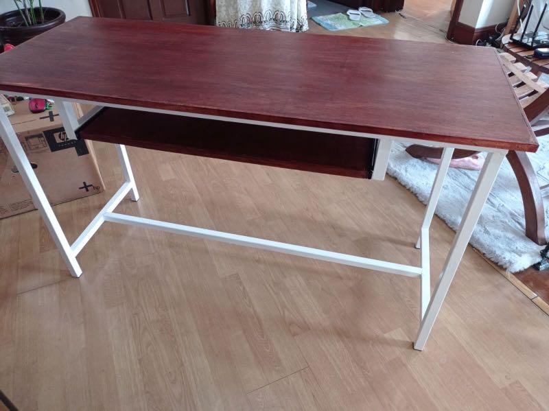 Desk with keyboard rack (Category: Tables & Sets) located in Quezon City. Submitted by c.millora (Listing ID 1039279304, Image 3). Description: Desk ideal for remote learning or work-from-home. Made of 1x1 high grade tubular steel and 3/4 marine plywood (more durable than mdf or particle boards. Dimensions: Table top: 127cm length x 53cm width (more than enough space for a laptop, monitor, led lamp, printer, etc) Keyboard rack: 70cm length x 35cm