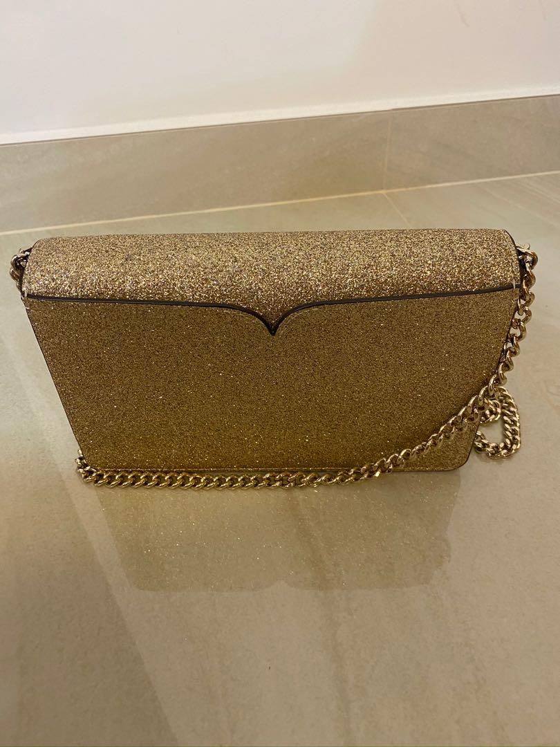 Kate Spade Nicola Shimmer Twistlock chain wallet in pale gold, Women's  Fashion, Bags & Wallets, Purses & Pouches on Carousell