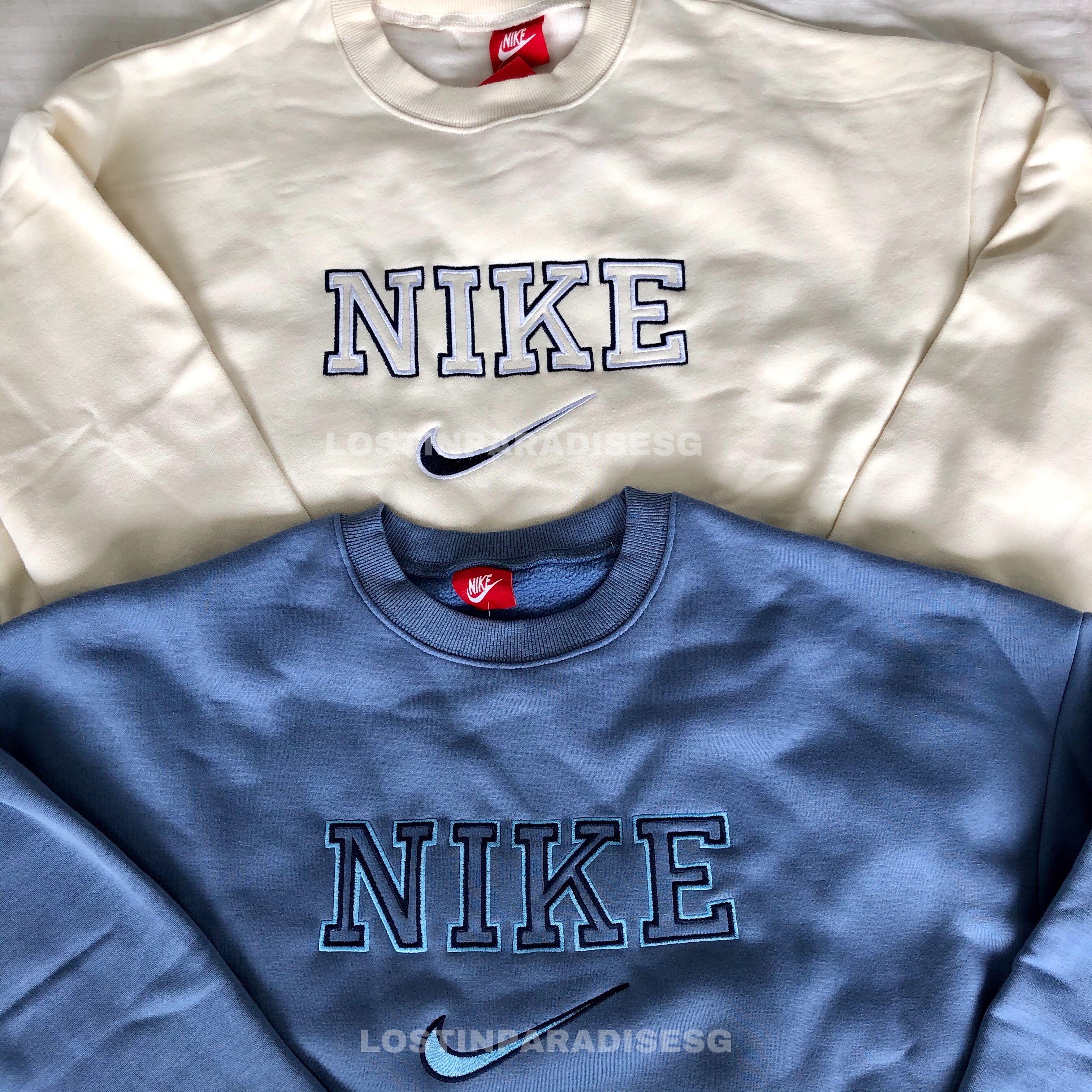 blue nike spellout sweatshirt