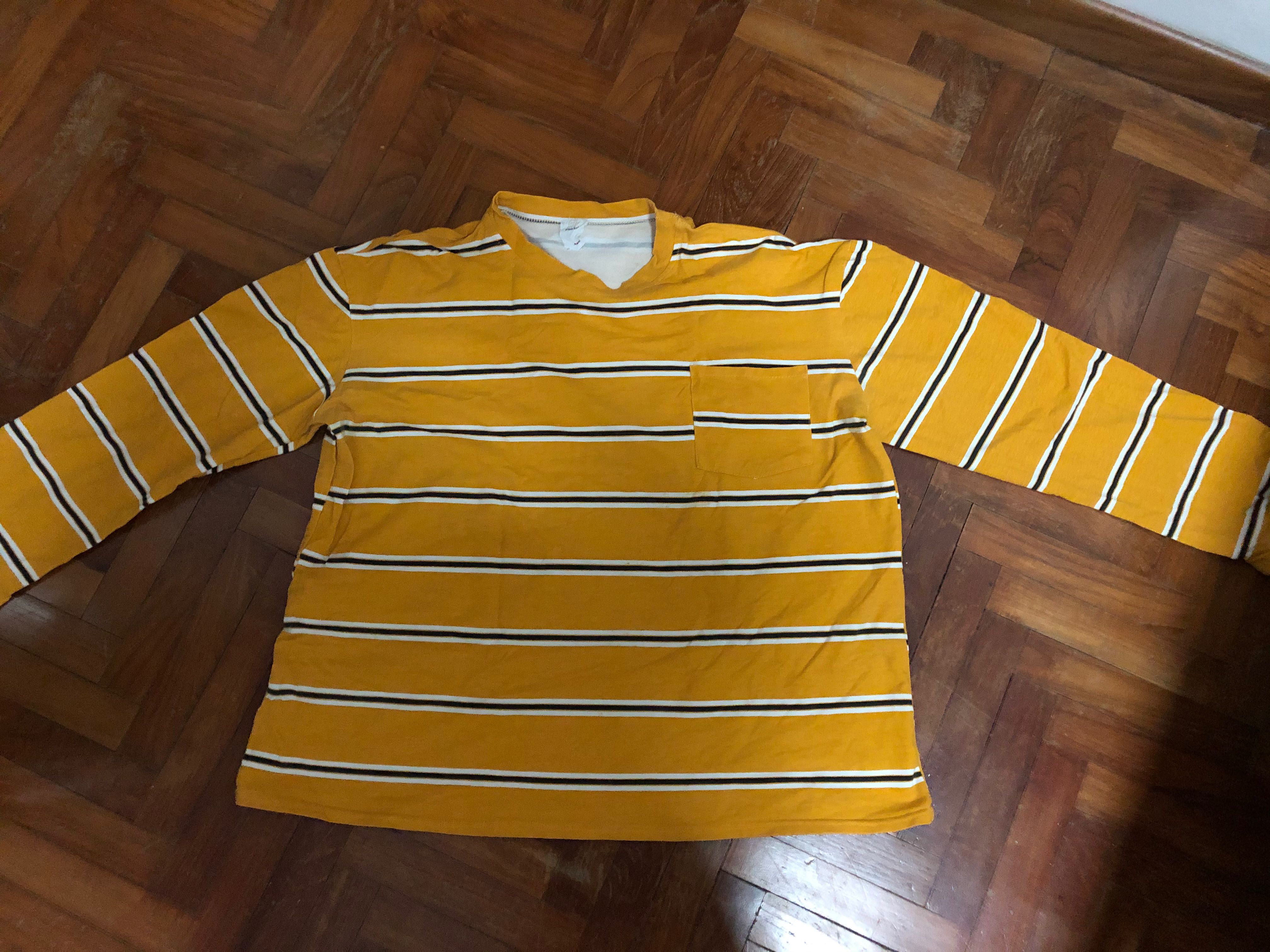 orange and yellow striped long sleeve shirt