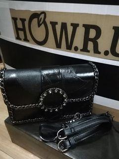 Black with chain details at the edges of the bag.