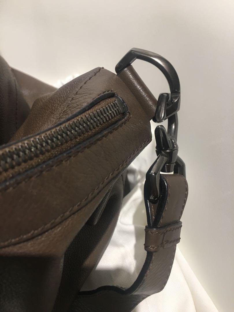 Givenchy (Category: Bags & Wallets) located in Singapore. Submitted by inickmen (Listing ID 1039864744, Image 3). Description: Givenchy Nightingale. Full leather. Hardly use. Condition still in great shape. Travel size, X large. Black clasps A beautiful piece. For Women / Men can use for documents too..
