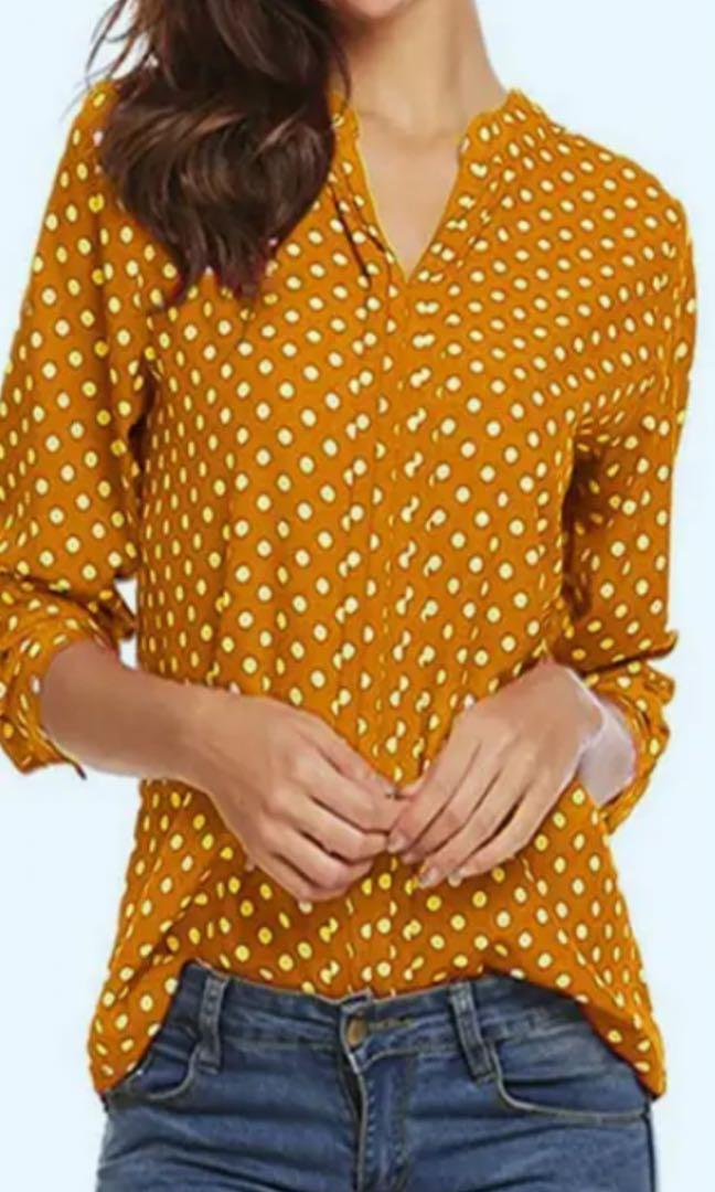 yellow and white polka dot blouse