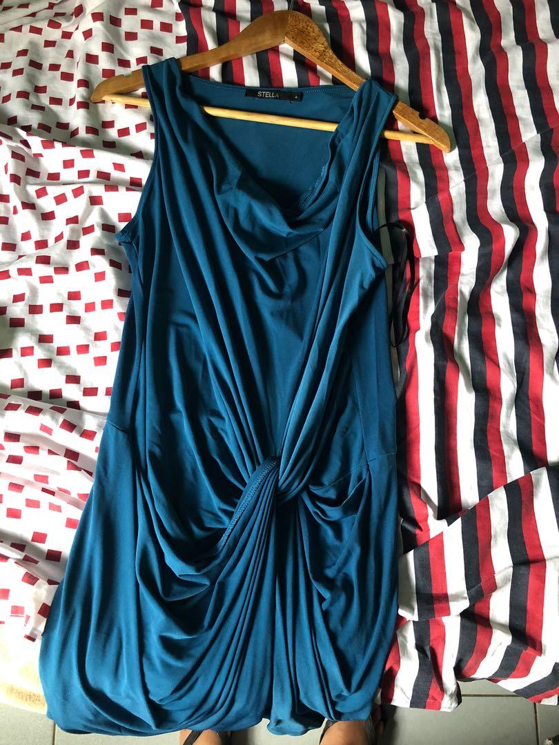 bodycon / sexy dress (Category: Dresses) located in Cainta. Submitted by jayds (Listing ID 1048077592, Image 2). Description: WHAT IS IT? - bodycon dress with unique tie design / sexy dress - STELLA brand (bought for Php2,300) - unlined inside but has like wrap around style of same cloth to secure tummy area - teal color - plunging neckline but not too revealing MATERIAL - not sure of material listing but definitely has stretch so elastane is pre