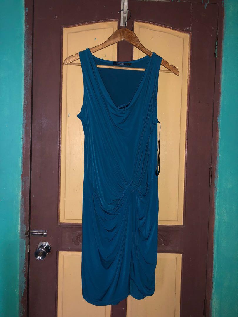 bodycon / sexy dress (Category: Dresses) located in Cainta. Submitted by jayds (Listing ID 1048077592, Image 3). Description: WHAT IS IT? - bodycon dress with unique tie design / sexy dress - STELLA brand (bought for Php2,300) - unlined inside but has like wrap around style of same cloth to secure tummy area - teal color - plunging neckline but not too revealing MATERIAL - not sure of material listing but definitely has stretch so elastane is pre