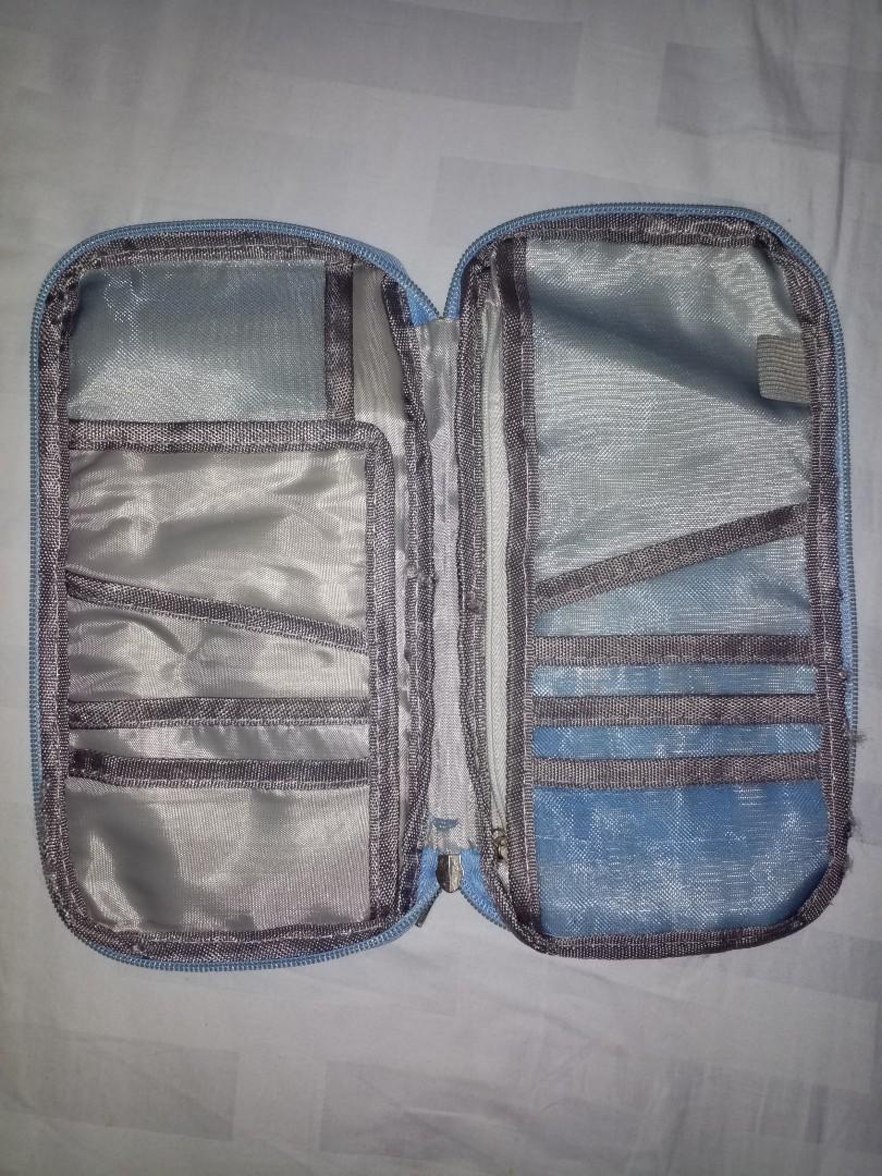 Travel organiser for passport docs etc. (Category: Travel Essentials & Accessories) located in Manila. Submitted by thingstoletgo2 (Listing ID 1048179427, Image 1). Description: Lots of compartment. Fix price..