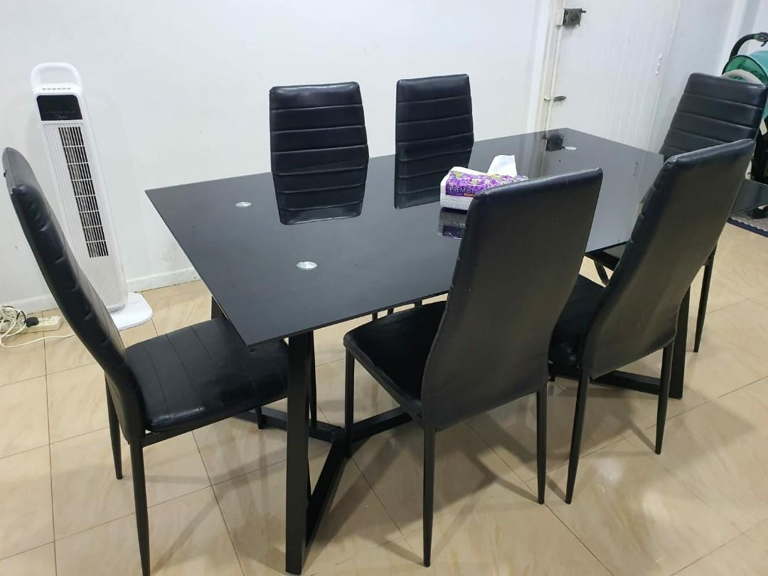 Dining table (Category: Tables & Sets) located in Singapore. Submitted by afis1988 (Listing ID 1048759672, Image 1). Description: giving away black tempered glass dining table with 6 chairs..small defects on chair not for fussy recipients...