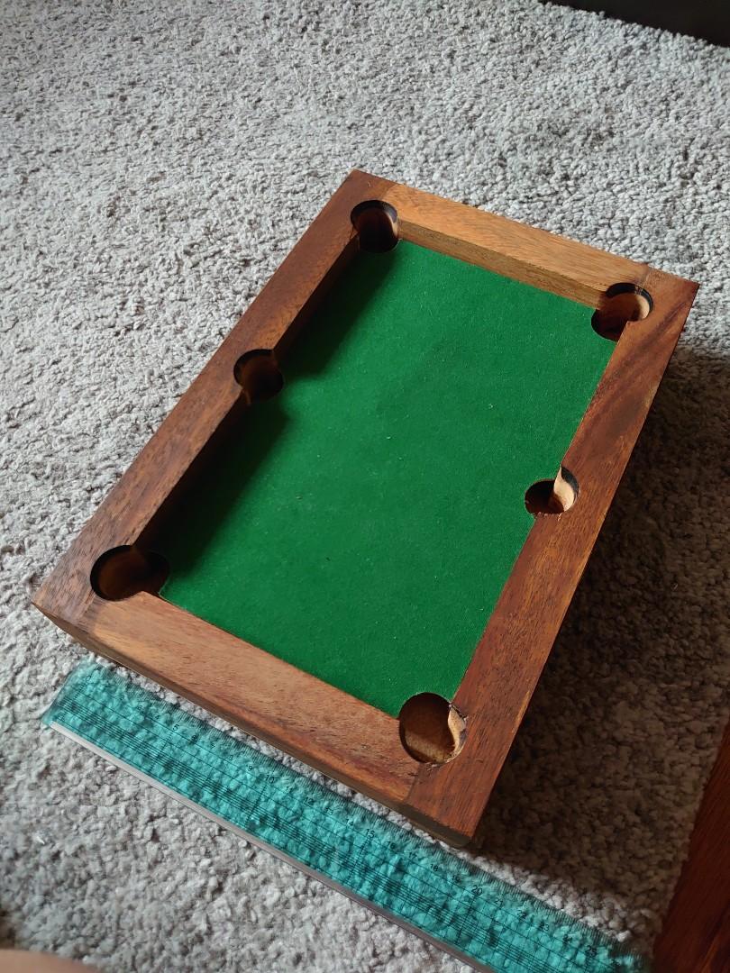 Mini Pool Table (Category: Billiards & Bowling) located in Singapore. Submitted by pewed (Listing ID 1049124853, Image 2). Description: Made of walnut wood size: 20 x 29.3 x 6.5cm complete set pretty much brand new.