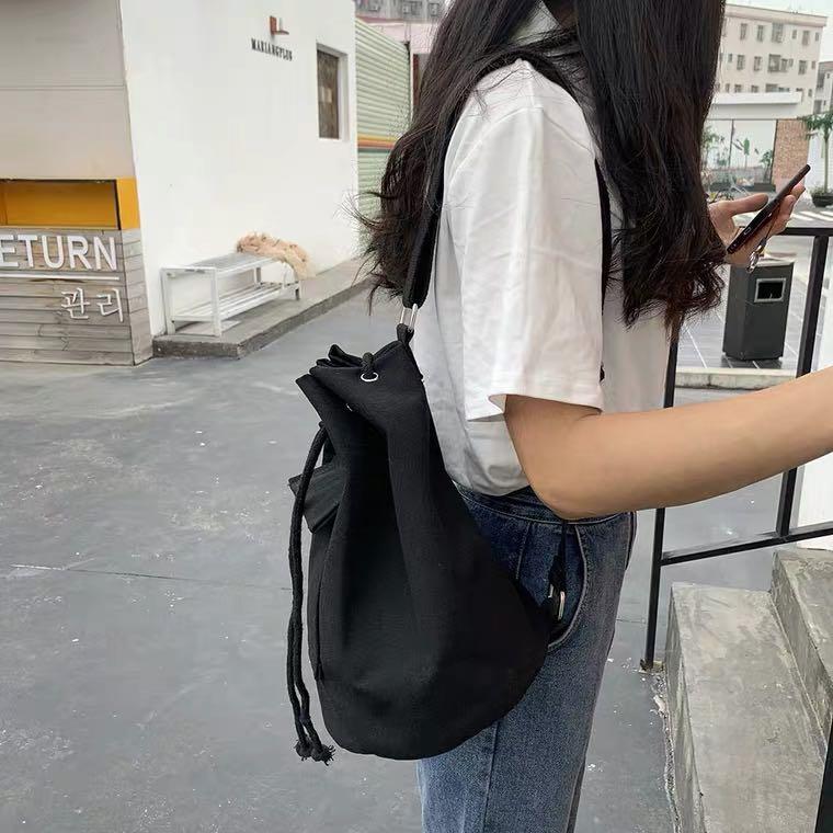 Taobao black bucket sling/backpack, Women's Fashion, Bags & Wallets, Tote  Bags on Carousell