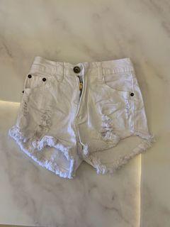 White ripped shorts