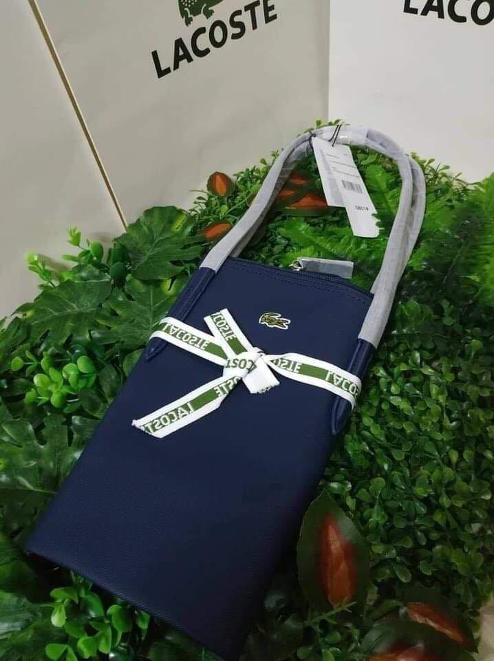 Lacoste Bag (Category: Tote Bags) located in Manila. Submitted by dsposable (Listing ID 1049686361, Image 1). Description: Mall pull out Available in 2 colors (Blue & Violet).