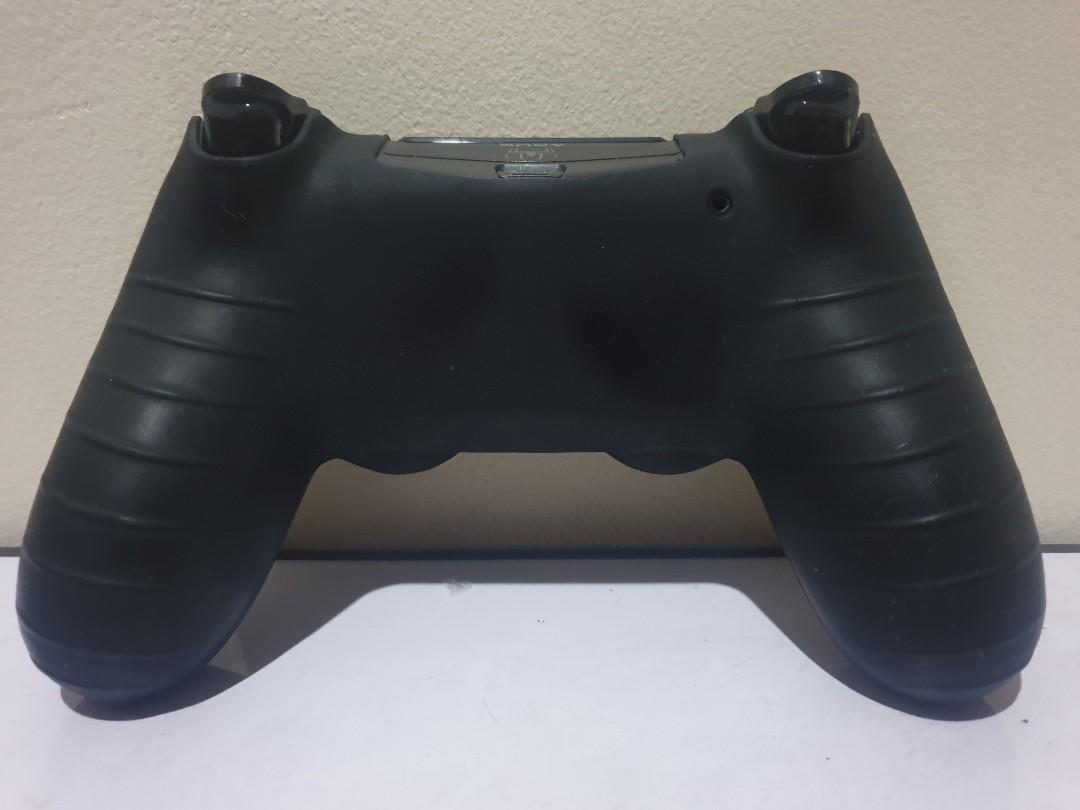Playstation 4 controller v1 (ds4, with jelly case) (Category: Controllers) located in Quezon City. Submitted by itemsforadoption (Listing ID 1049670674, Image 2). Description: Rfs: Coming back from my quarantine break to post more items to sell. I'll probably post more than 50 items over the course of these few days. Decluttering spare controllers Item Description: Jet black v1 ds4. Looks quite worn. Used a decent amount. No box. The up and right