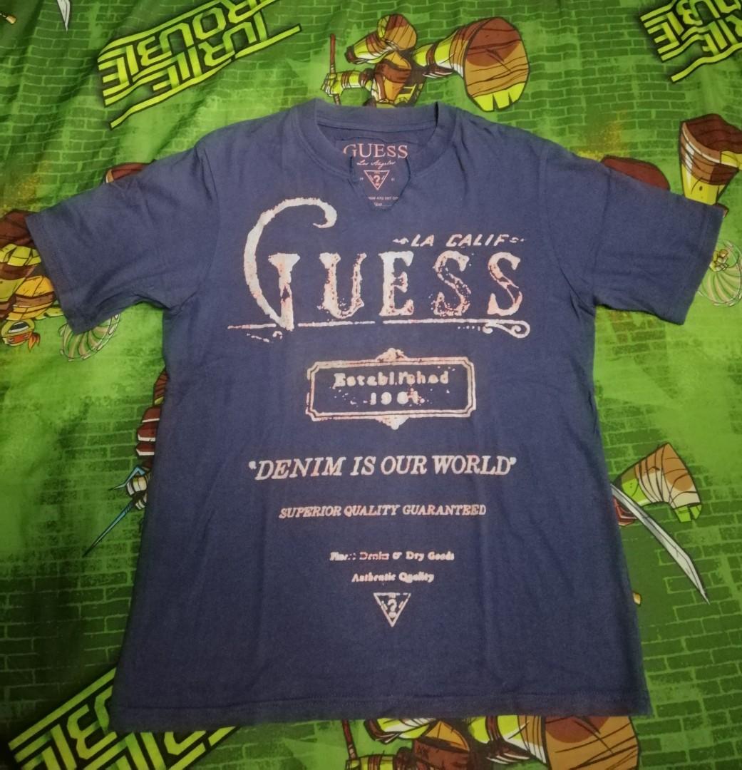 green and purple guess shirt