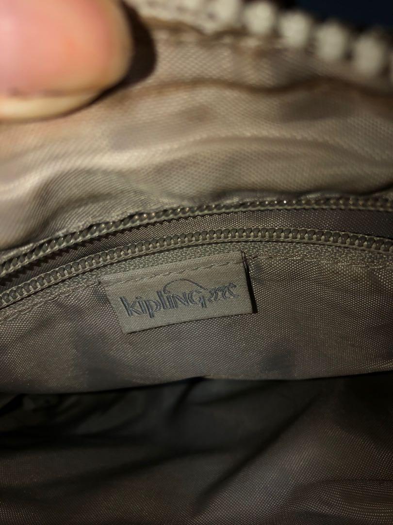 Authentic Kipling Keiko Stars (Category: Purses & Pouches) located in Cagayan de Oro. Submitted by kaggerrohsweets (Listing ID 1046306889, Image 3). Description: This is my preloved item, used but was never abused. No hidden defects. Silver hardwares. The monkey looks so chic. Decluttering bags Adjustable crossbody strap. Top zip closure. Inner pocket details: 1 main compartment pocket. Outer pocket details: 2 outside zip pockets. Dimensions: 8"W