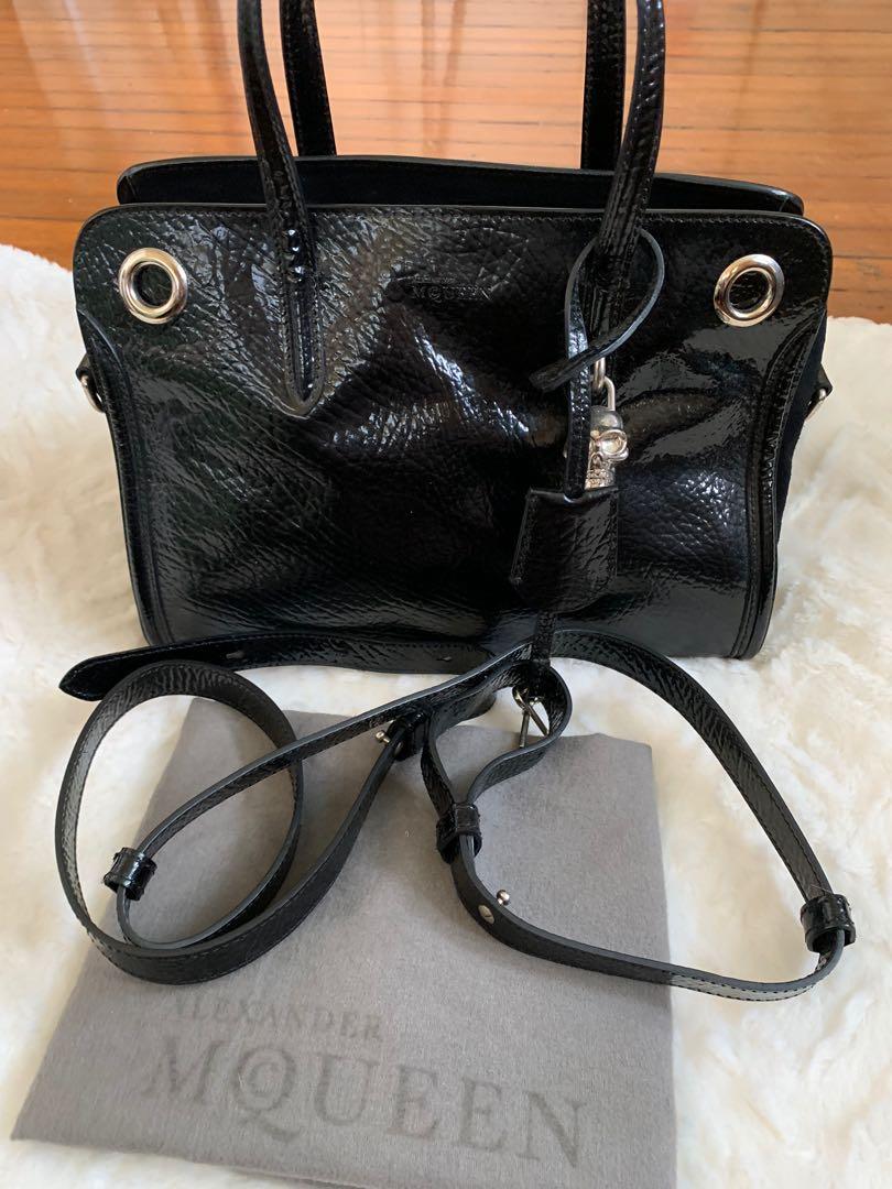 Alexander Mc Queen handbag (Category: Luxury Bags & Wallets) located in Makati City. Submitted by myterry1941 (Listing ID 1050275834, Image 1). Description: Authentic Alexander Mc Queen padlock satchel bag Suede and shiny leather finish Comes with dust bag and serial card.
