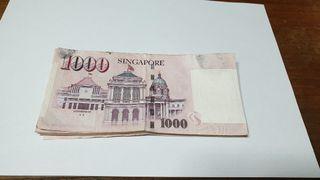 This is a Monetary Authority of Singapore series note  1000dollar real currency note