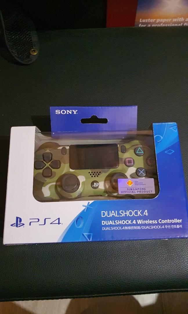 PS4 Controller Mint condition (Category: Controllers) located in Singapore. Submitted by trytotry (Listing ID 1050913808, Image 1). Description: Authentic Dualshock PS4 controller Camo, Actually wanted to Mod it, but lazy. Barely used. 1 Week old. Perfect Condition for all buttons and joy stick comes with a pair of free joystick silicone cover.