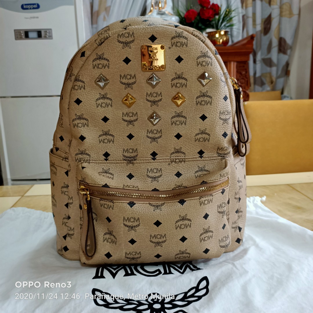 Authentic MCM Backpack ( Look at the receipt and if its fake i will hold  full legal resonsibilty ), Luxury, Bags & Wallets on Carousell