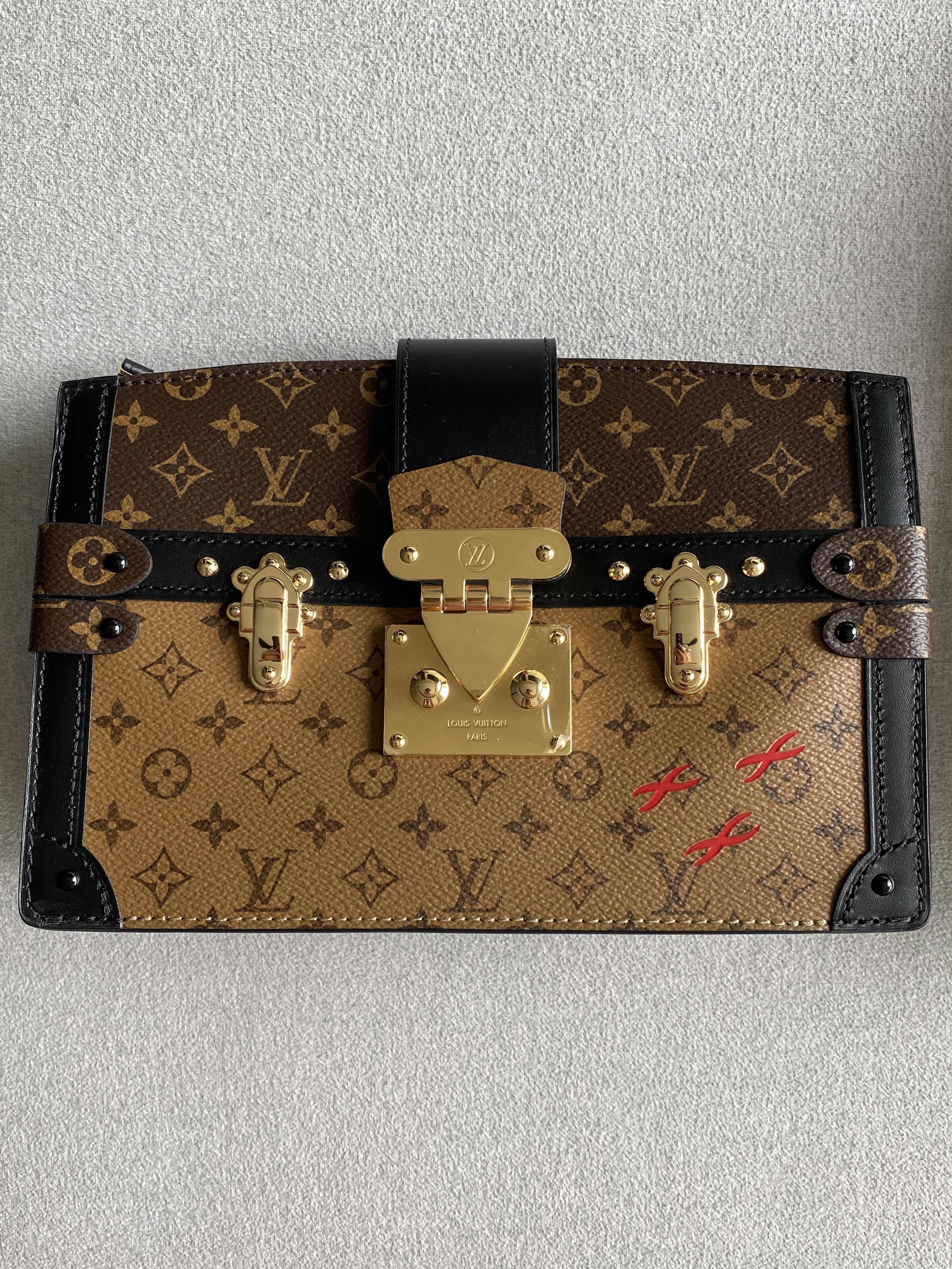 Sold at Auction: LOUIS VUITTON clutch/wrist bag SOFT TRUNK CLUTCH