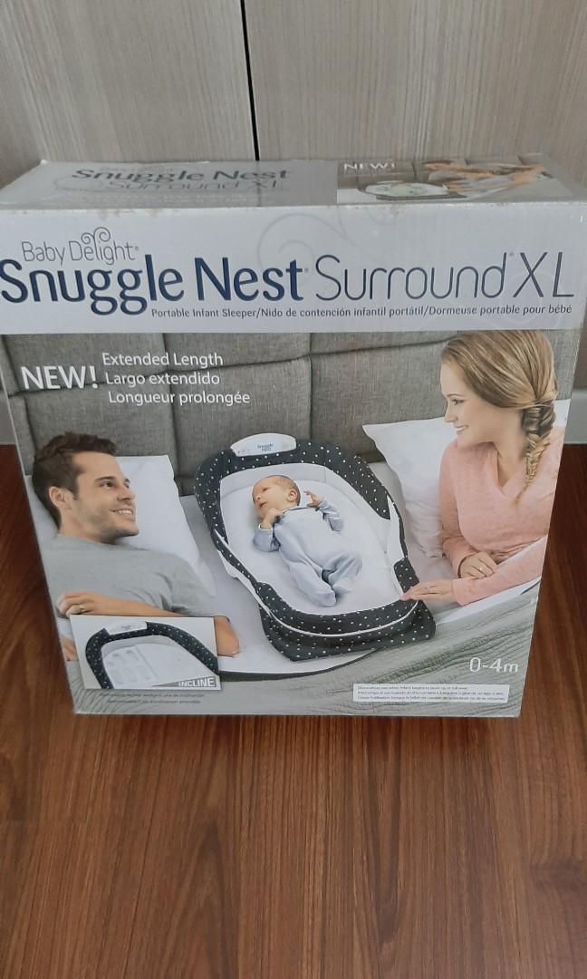 Snuggle Nest Surround XL (Category: Cots & Cribs) located in Antipolo. Submitted by tringarcilla (Listing ID 1051639643, Image 1). Description: Use to create a more open and protective area for a baby sleeping in an adult bed Sound & Light unit offers a soft light and soothing womb sounds and the relaxing melodies of Brahms’ Lullaby Five-level volume control and automatic shut-off lets you create the perfect sleep environment for your little one 