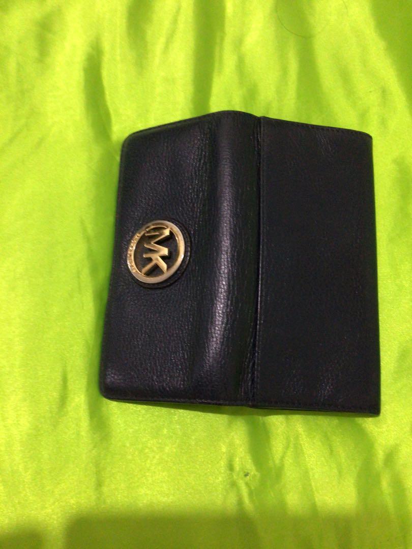 Michael Kors Hobo bag and Mk wallet Set (Category: Luxury Bags & Wallets) located in Paranaque City. Submitted by lcristobal (Listing ID 1052262098, Image 3). Description: Preloved Bundled with MK original wallet Genuine leather Bought in MK US Cracks on bag handle but still presentable Dark blue in color Gold hardware Sign of usage but still presentable Wallet only 1500 Bag 1800 If bundled P2800 .