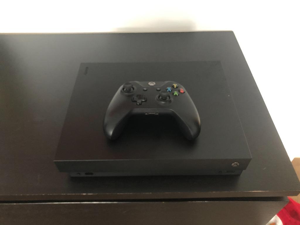 Xbox one X (Category: Xbox) located in Singapore. Submitted by alexj4x (Listing ID 1052195087, Image 1). Description: Xbox one x in perfect working condition. Comes with 1 controller, 1 HDMI cable and power cable. Selling because bought Xbox Serie X. No box..