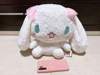 Cinnamoroll plush toy with pink ribbon