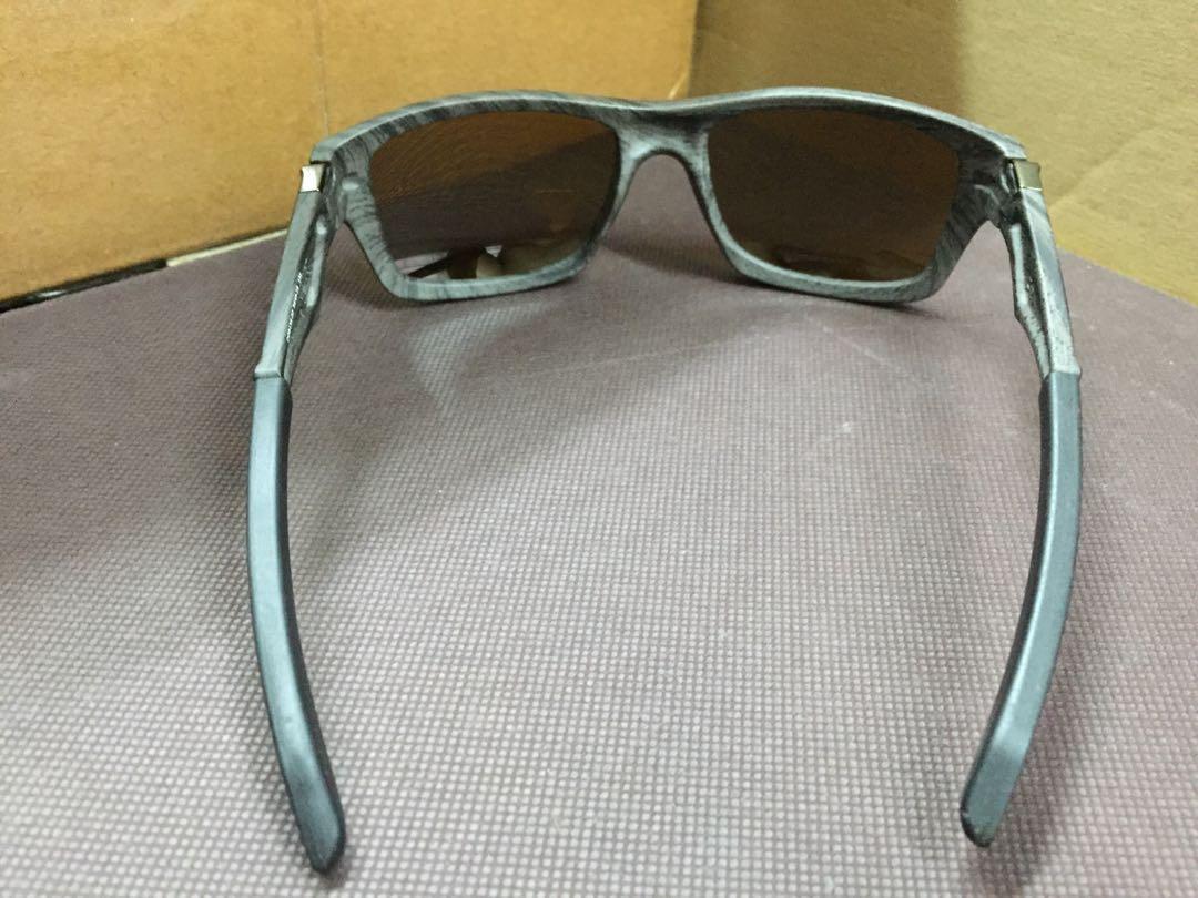 Oakley Jupiter woodgrain tungsten iridium polarized sunglasses