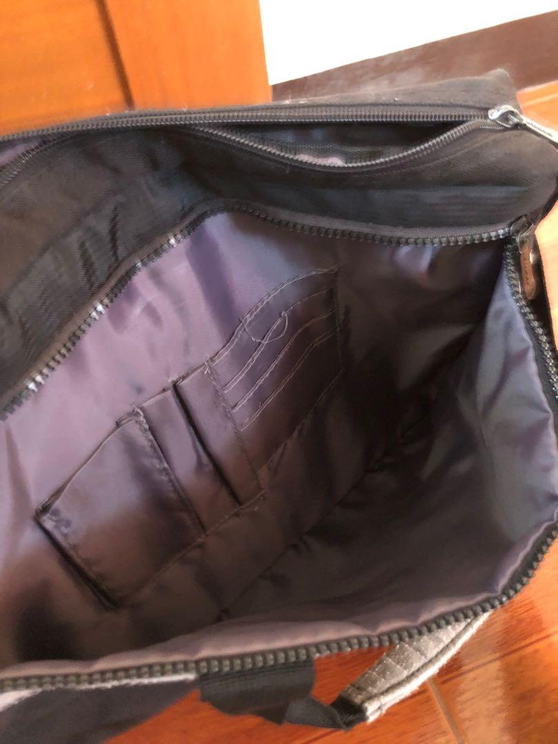 Original Lenovo laptop bag (Category: Laptops & Notebooks) located in Cavite. Submitted by enaherc (Listing ID 1052691563, Image 3). Description: Can fit 14" laptop. Zippers are functional. rfs: decluttering cabinet pm me for faster transaction!.
