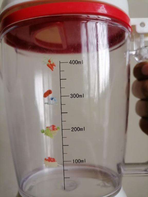 Measuring Cup/ Condiments Container/ Pitcher (Large) (Category: Other Kitchenware & Tableware) located in San Mateo. Submitted by Babyfume (Listing ID 1047008679, Image 3). Description: BOUGHT IN THE MIDDLE EAST A clear transparent plastic container with cover and removable stopper used as a measuring cup or condiments container can also be a beverage pitcher accurate measuring container best used for salt, sugar, flour and other power forms stur