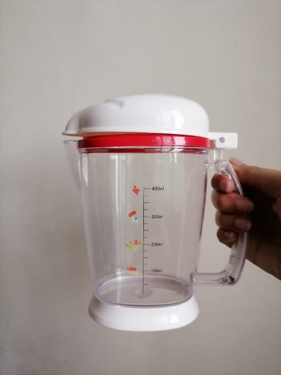 Measuring Cup/ Condiments Container/ Pitcher (Large) (Category: Other Kitchenware & Tableware) located in San Mateo. Submitted by Babyfume (Listing ID 1047008679, Image 2). Description: BOUGHT IN THE MIDDLE EAST A clear transparent plastic container with cover and removable stopper used as a measuring cup or condiments container can also be a beverage pitcher accurate measuring container best used for salt, sugar, flour and other power forms stur