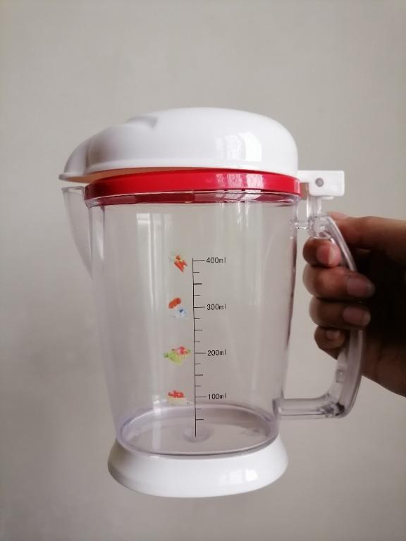 Measuring Cup/ Condiments Container/ Pitcher (Large) (Category: Other Kitchenware & Tableware) located in San Mateo. Submitted by Babyfume (Listing ID 1047008679, Image 1). Description: BOUGHT IN THE MIDDLE EAST A clear transparent plastic container with cover and removable stopper used as a measuring cup or condiments container can also be a beverage pitcher accurate measuring container best used for salt, sugar, flour and other power forms stur