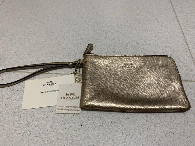 coach bronze wristlet