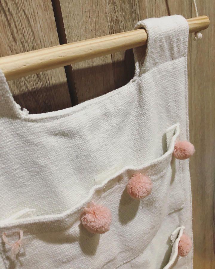 Hanging Fabric Organizer (Category: Changing Mats & Accessories) located in Las Pinas. Submitted by momma_on_a_hunt_ph (Listing ID 1047741341, Image 3). Description: Preloved, hanged buy hardly used 3 pockets with velcro Made of thick canvass Needs a little of repair on the pompom detail (not in photo: loose pompom kept inside pocket, not missing).