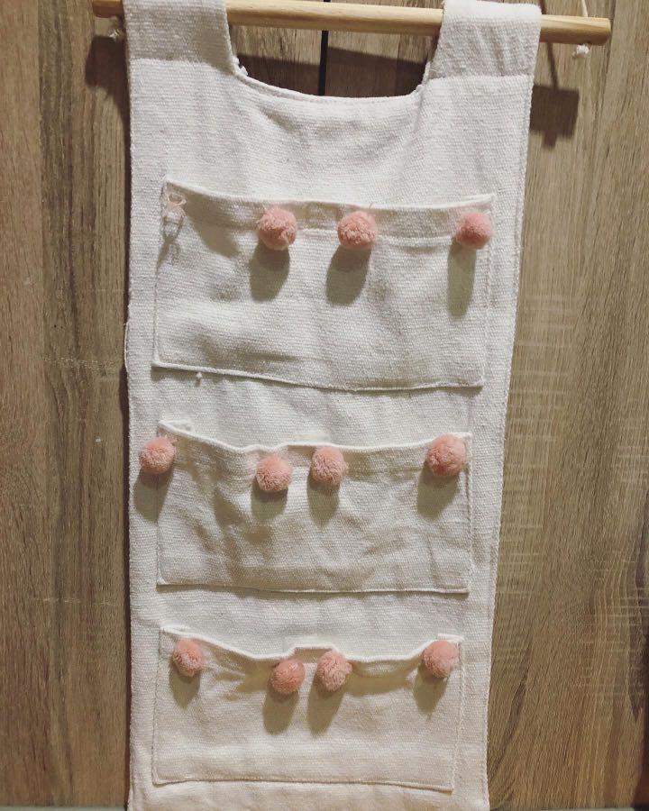Hanging Fabric Organizer (Category: Changing Mats & Accessories) located in Las Pinas. Submitted by momma_on_a_hunt_ph (Listing ID 1047741341, Image 1). Description: Preloved, hanged buy hardly used 3 pockets with velcro Made of thick canvass Needs a little of repair on the pompom detail (not in photo: loose pompom kept inside pocket, not missing).