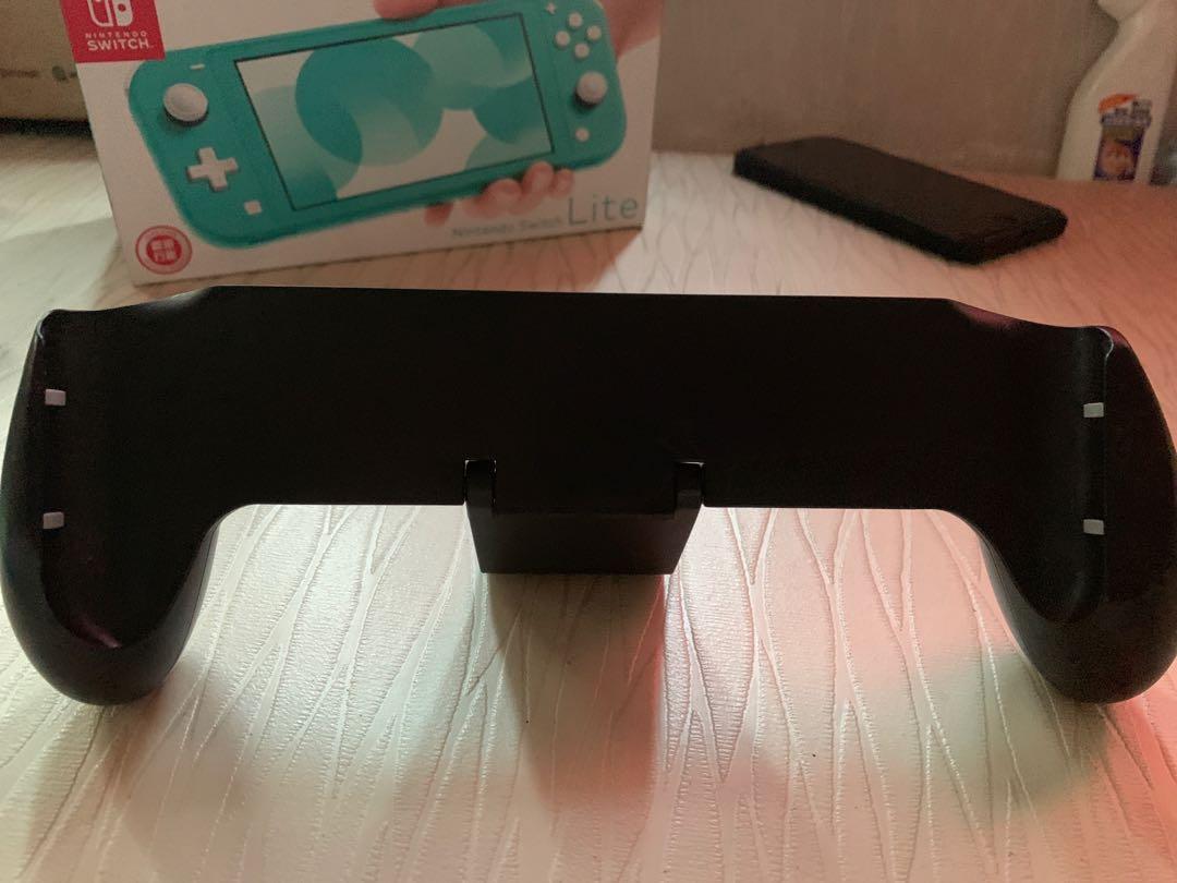 Nintendo switch lite with 2 games (Category: Nintendo) located in Pasay City. Submitted by ayinong168 (Listing ID 1047980375, Image 2). Description: Item is in excellent condition working with 2 physical games nba 2k19 and nba 2k20 with accessories stand pm for inquiries .