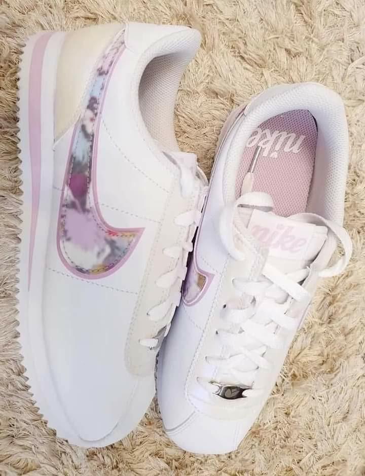 nike shoes with floral swoosh
