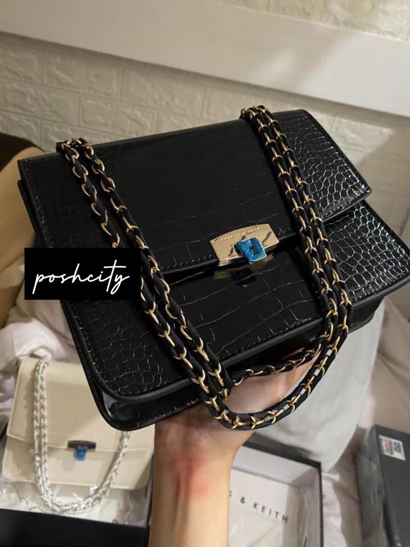 Charles and Keith Croc Pushlock Convertible Chain Bag (Category: Luxury Bags & Wallets) located in Taguig. Submitted by poshcity (Listing ID 1055286791, Image 3). Description: ✨PLEASE MAKE READING A HABIT✨ Facebook page: @poshcity Stated down below all the details and informations about the item. Shop at your own risk. BAGS ARE ALL ON HAND 💕 👜: Charles and Keith Croc Pushlock Convertible Chain Bag ✨: With Box, Tag and Serial Number ✨: Black and