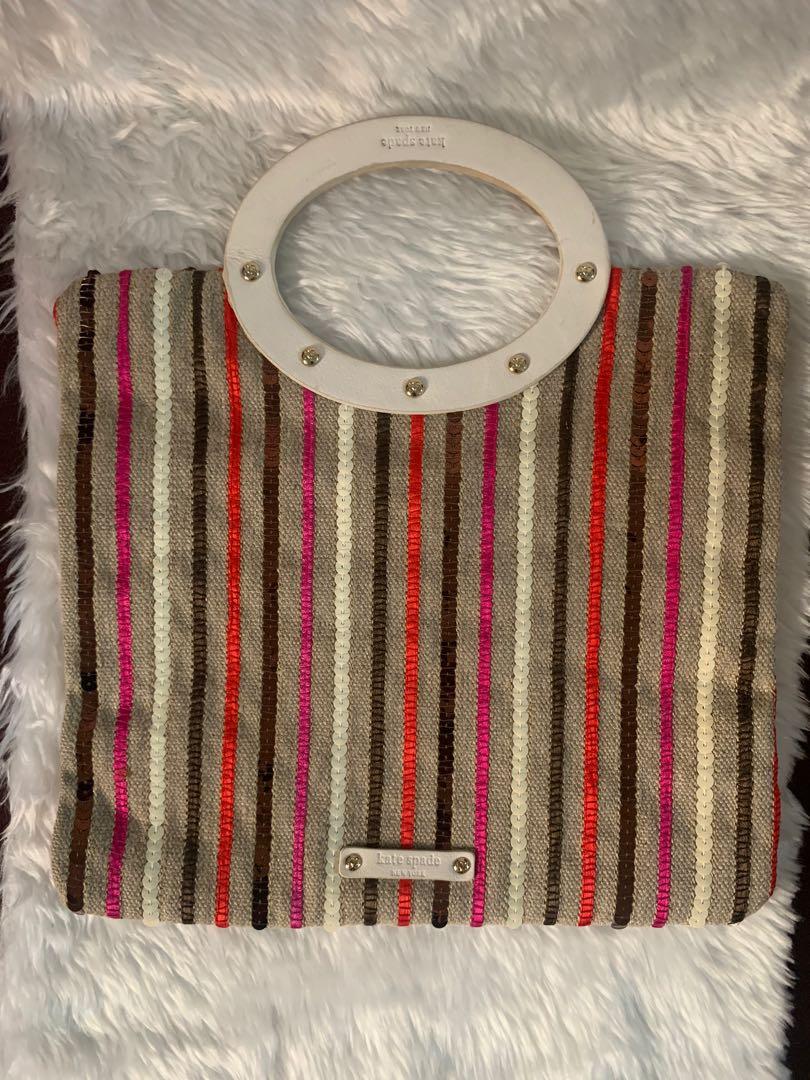 Kate Spade Handbag/Clutch Bag (Category: Luxury Bags & Wallets) located in Muntinlupa City. Submitted by mc_shopgram (Listing ID 1055354912, Image 2). Description: 💯 Authentic. Excellent condition. Brand: Kate Spade Size: 9.75 in. (height) x 10.5 in. (width); bag handle loop size - 3 in. Beige canvas clutch bag/handbag with white top handle, multicolored sequins, exterior zip pocket, polka dot interior cloth lining, interior small pockets. Can b