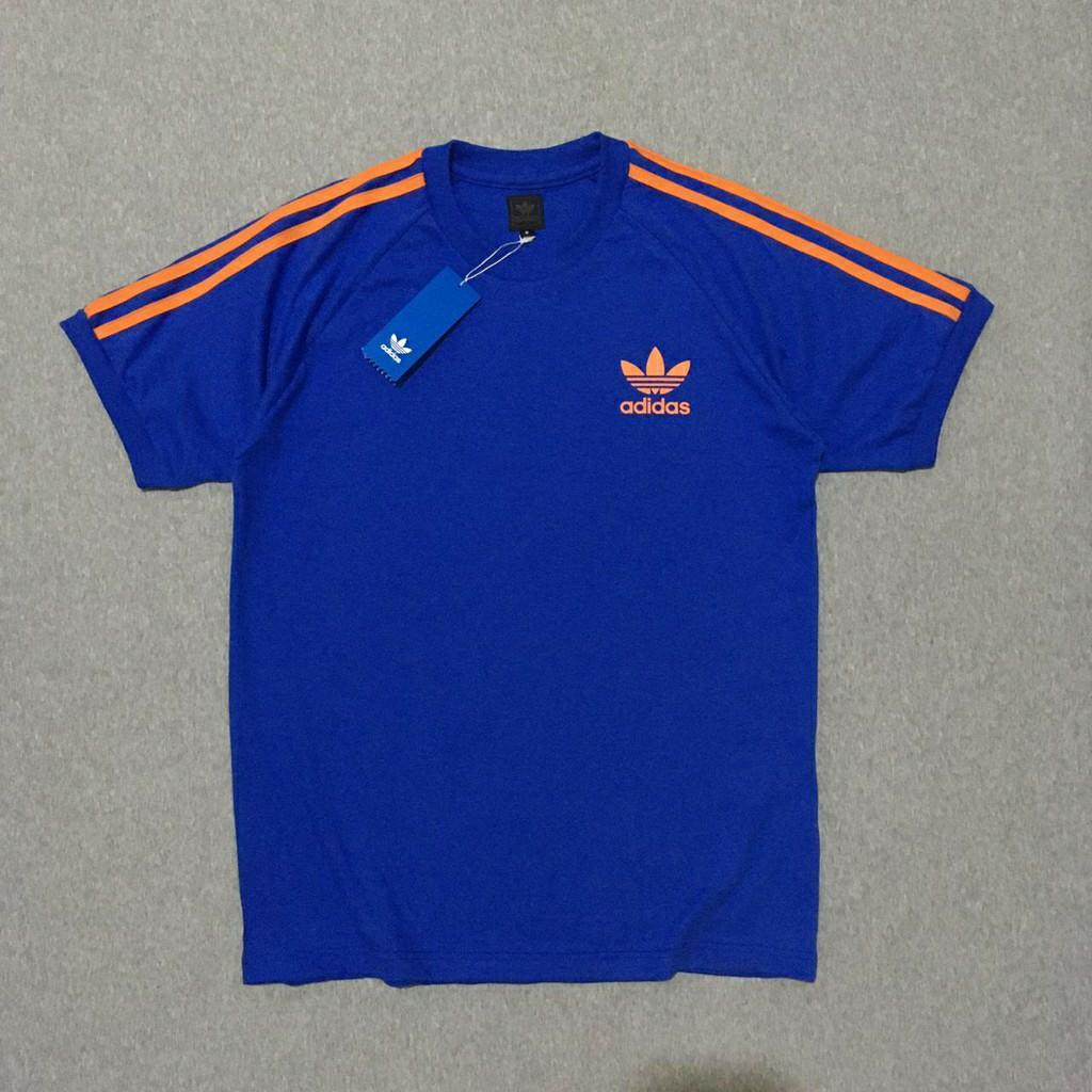 Adidas blue sale with orange stripes