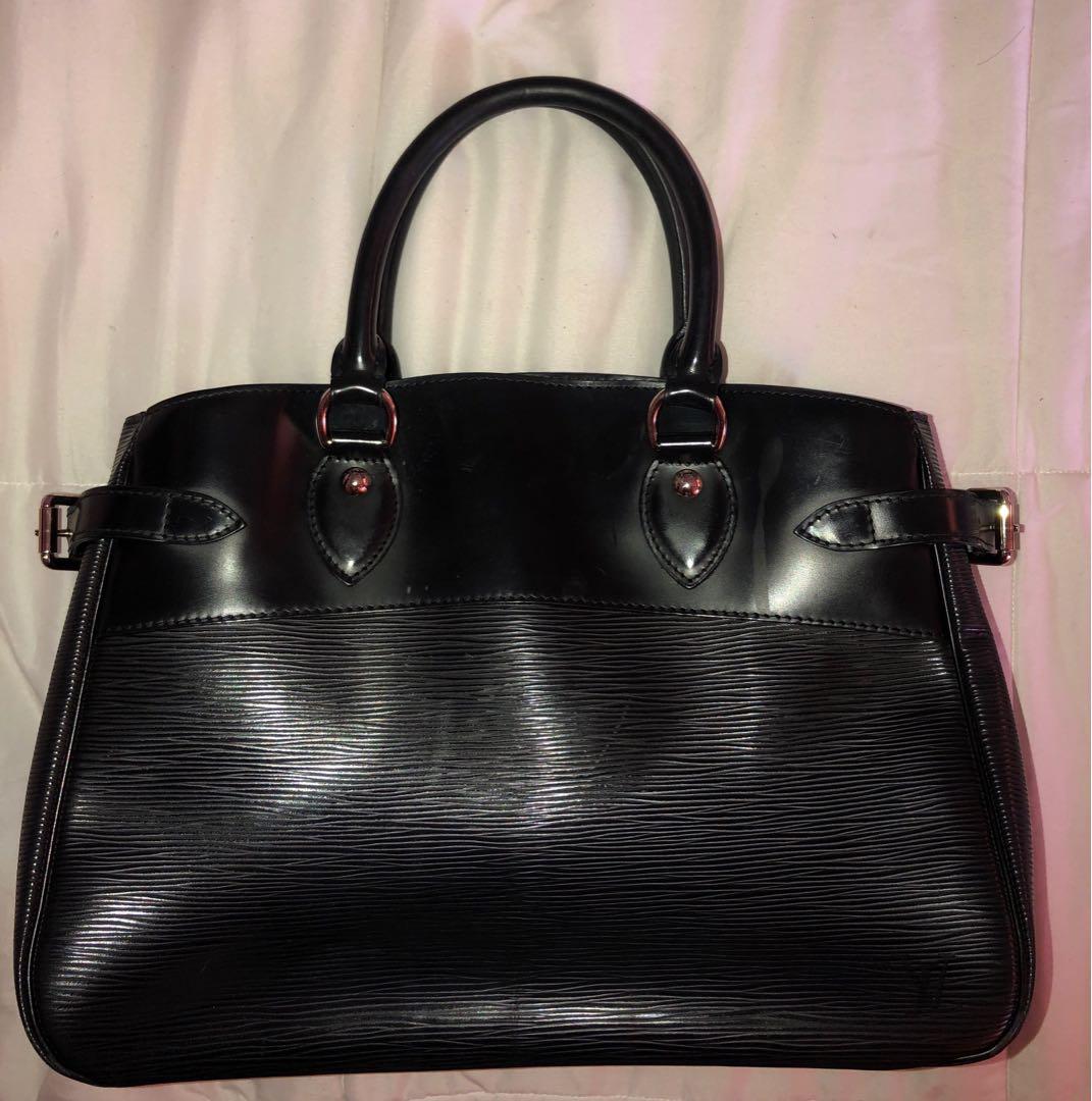 LOUIE VUITTON EPI PASSY PM BLACK BAG (Category: Luxury Bags & Wallets) located in Quezon City. Submitted by skyy10 (Listing ID 1056348297, Image 1). Description: LOUIE VUITTON EPI PASSY PM BLACK BAG CONDITION: VERY GOOD CONDITION PLEASE READ: We guarantee this is an Authentic LOUIE VUITTON Epi Passy Pm handbag or 100% of your money back. This stunning tote is crafted of Louie Vuitton signature textured Epi leather. The tote features smooth rolled