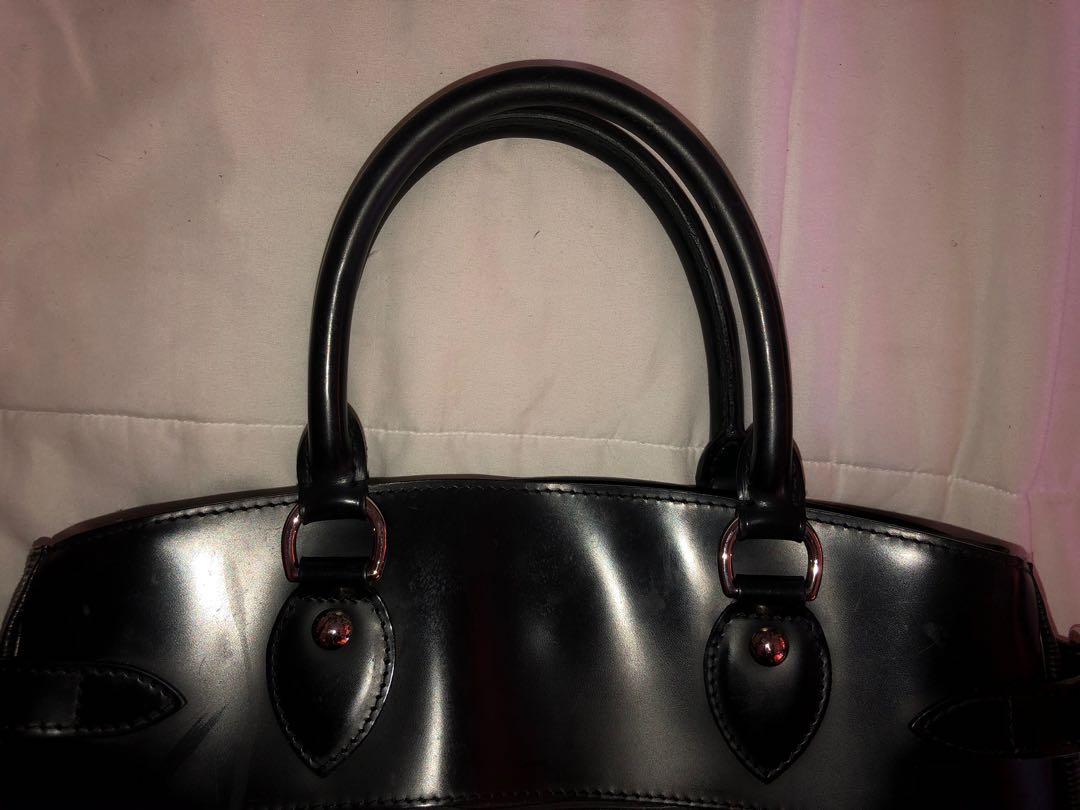LOUIE VUITTON EPI PASSY PM BLACK BAG (Category: Luxury Bags & Wallets) located in Quezon City. Submitted by skyy10 (Listing ID 1056348297, Image 2). Description: LOUIE VUITTON EPI PASSY PM BLACK BAG CONDITION: VERY GOOD CONDITION PLEASE READ: We guarantee this is an Authentic LOUIE VUITTON Epi Passy Pm handbag or 100% of your money back. This stunning tote is crafted of Louie Vuitton signature textured Epi leather. The tote features smooth rolled