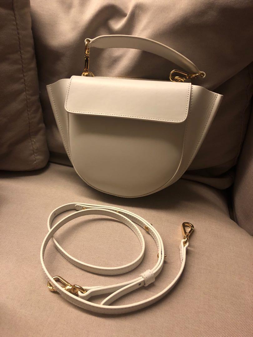 Wandler Mini Hortensia Bag (Category: Luxury Bags & Wallets) located in Mandaluyong City. Submitted by declutteringacct (Listing ID 1056359581, Image 1). Description: Hard to find color (white) Practically brandnew Creasing on the pull tab is normal ‘cause of the material With short and long strap, card, and dustbag.
