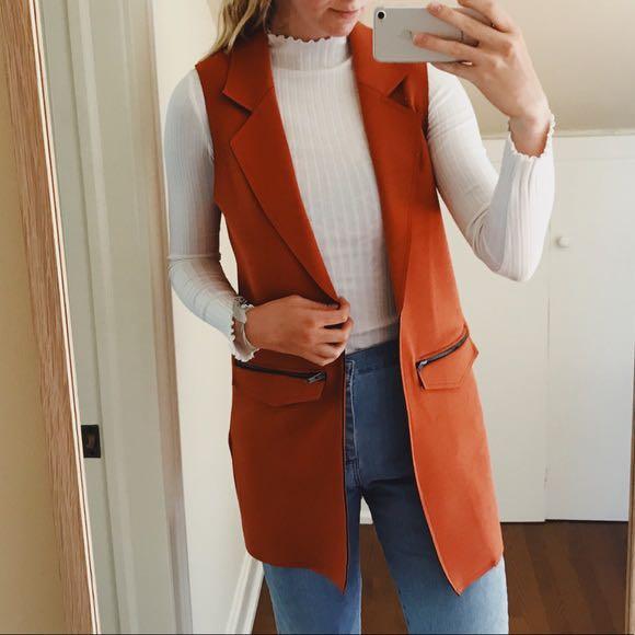 orange sleeveless jacket