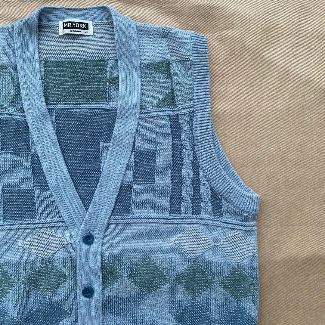 teal sweater vest