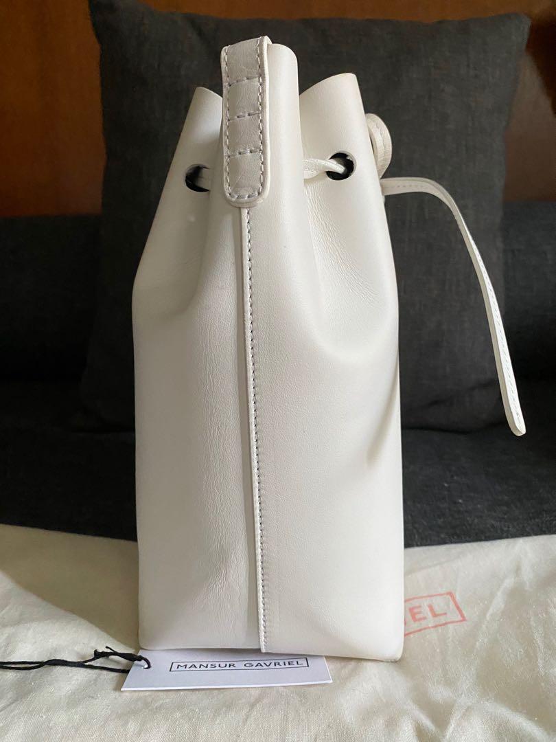 Mansur Gavriel Mini White Bucket bag (Category: Luxury Bags & Wallets) located in Muntinlupa City. Submitted by bagstagram (Listing ID 1053070029, Image 3). Description: Mini bucket bag from mansur gavriel 7.5" x 10.5" x 5", 37.5" adjustable shoulder strap all-over smooth leather with drawstring top closure.